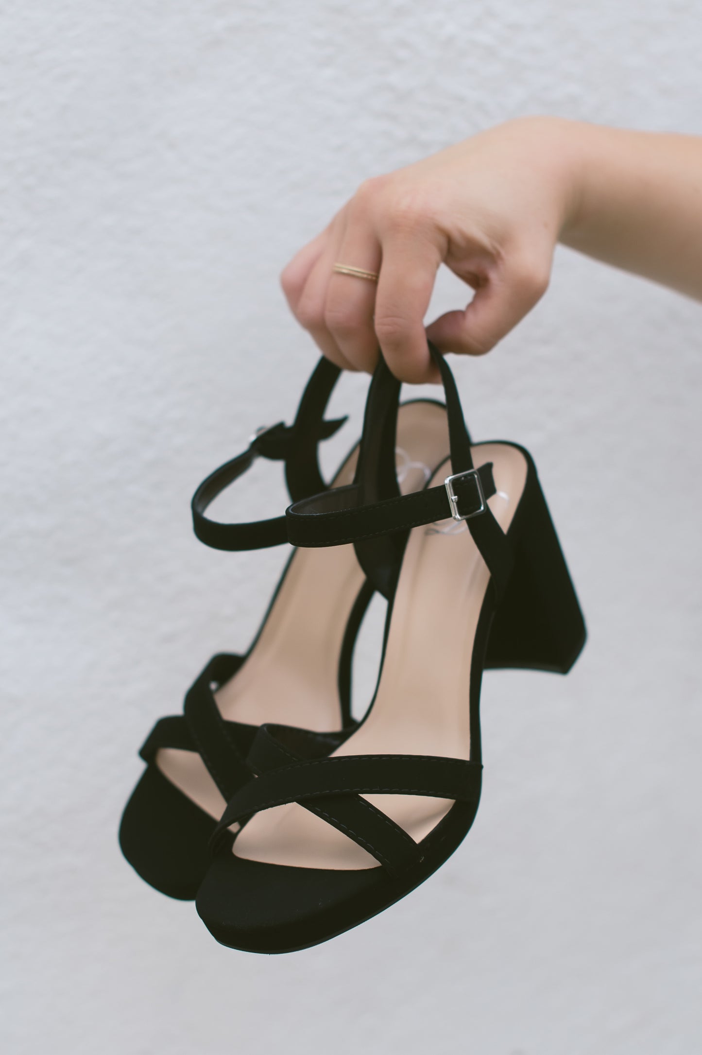 A black open-toe block heel with a small platform in a soft nubuck material, with an adjustable ankle strap and cross-strap across the toes