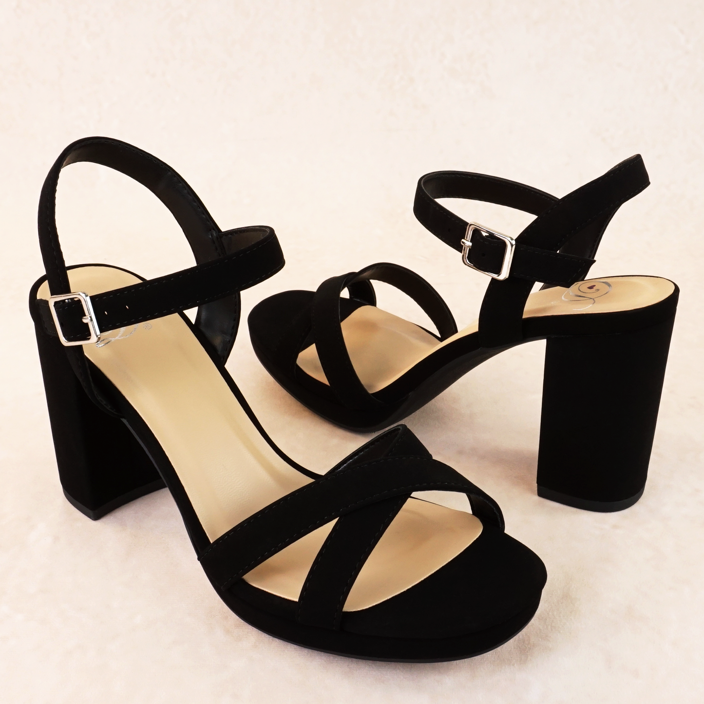 A black open-toe block heel with a small platform in a soft nubuck material, with an adjustable ankle strap and cross-strap across the toes
