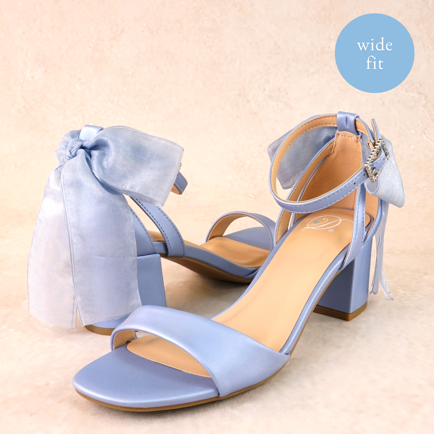 Wide fit simple low 2.5" block heel in blue with a bow at the back