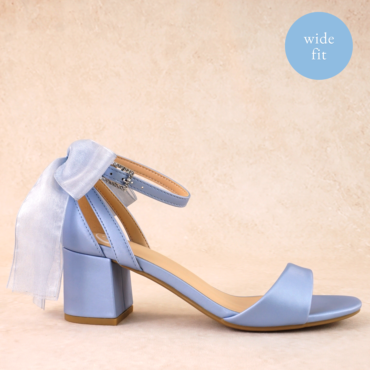 Wide fit simple low 2.5" block heel in blue with a bow at the back