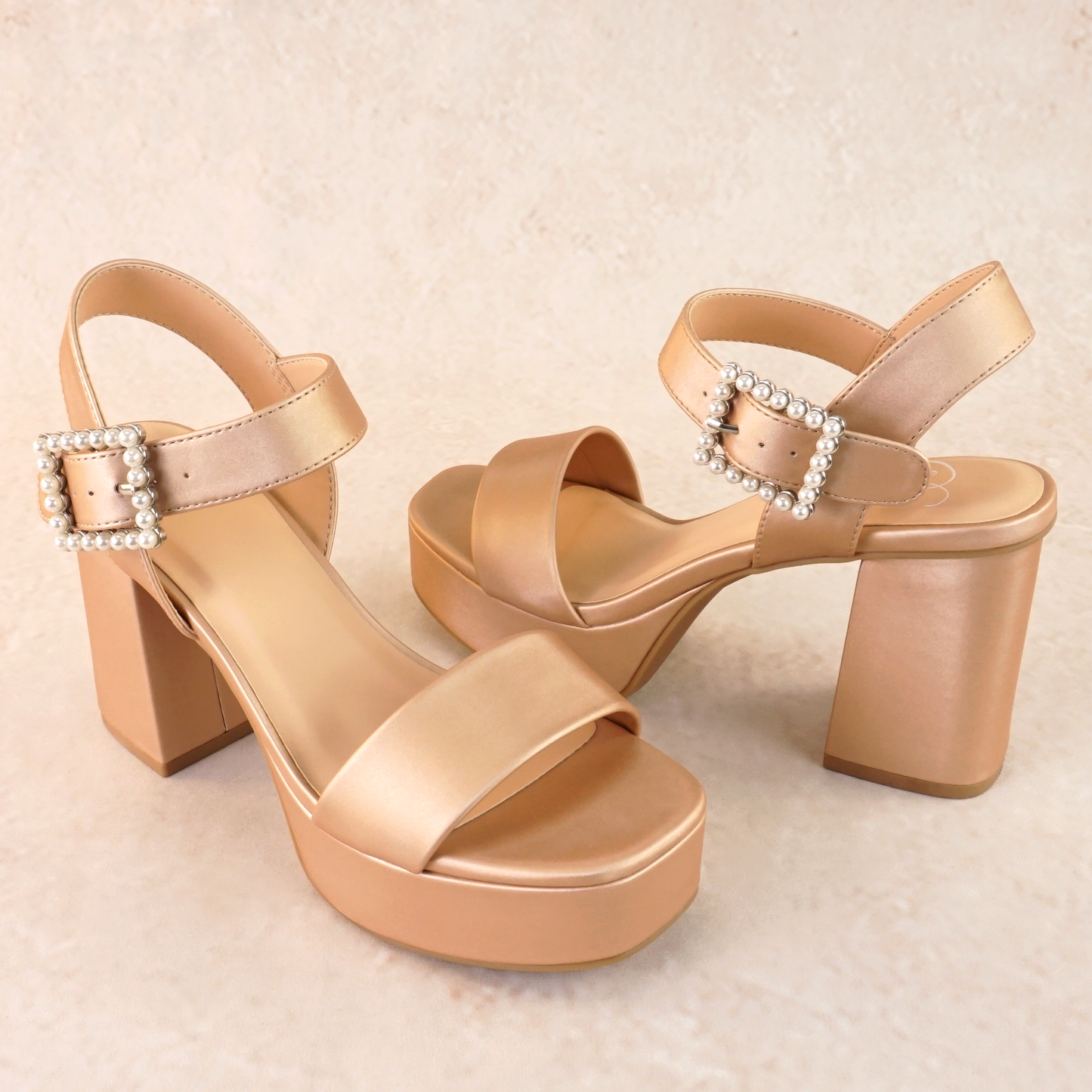 3.75" block heel in champagne with 1.5" platform and a pearl detail buckle