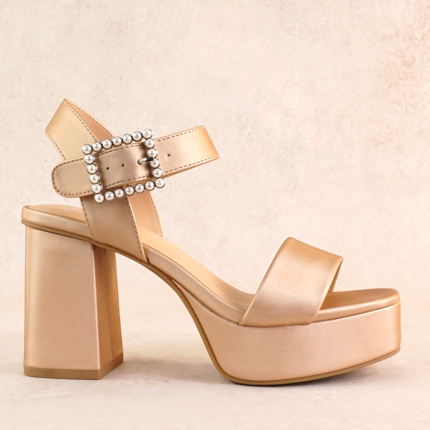 3.75" block heel in champagne with 1.5" platform and a pearl detail buckle