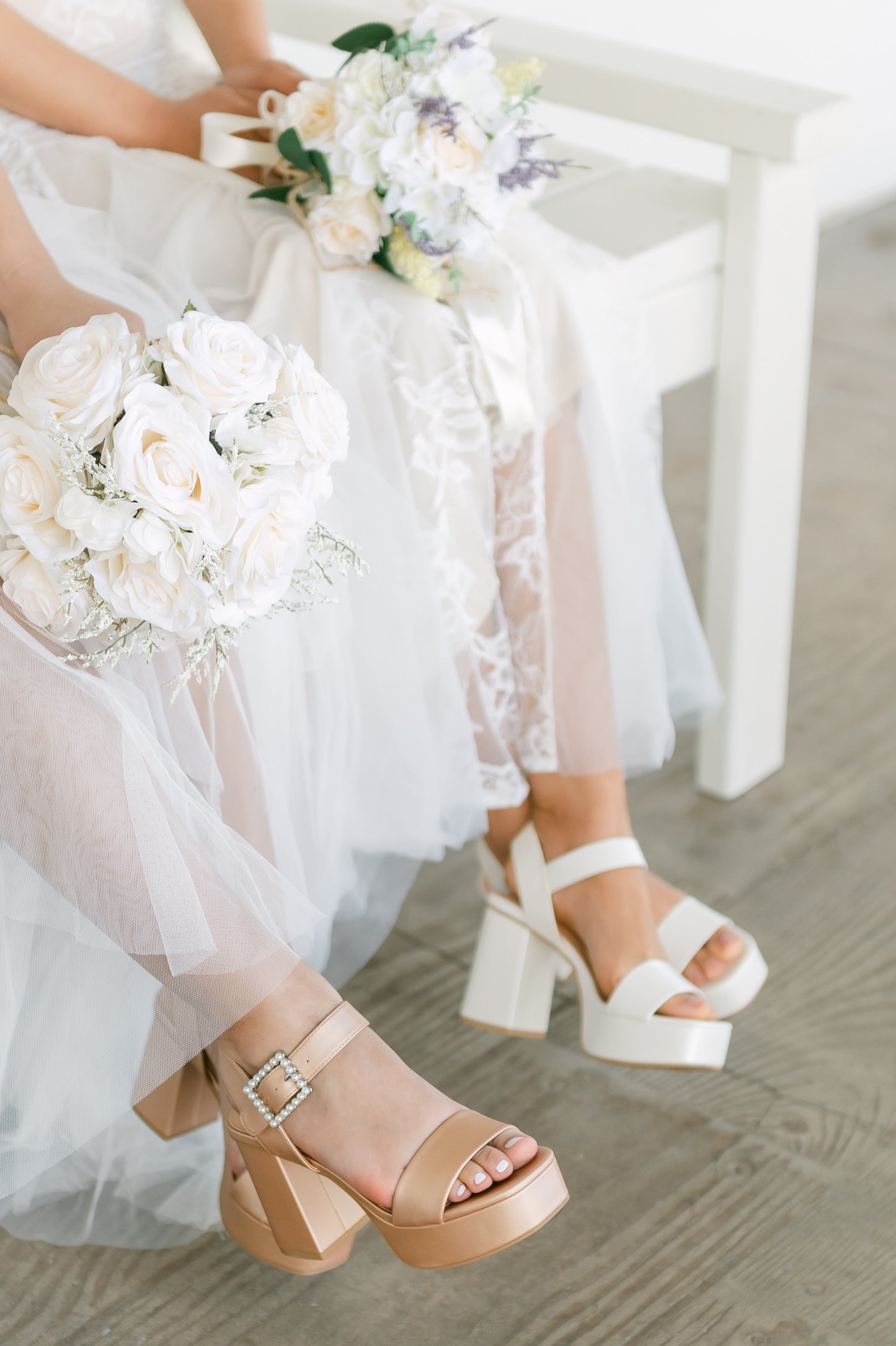 3.75" block heels in champagne and white with 1.5" platform and a pearl detail buckle worn by two women in white dresses