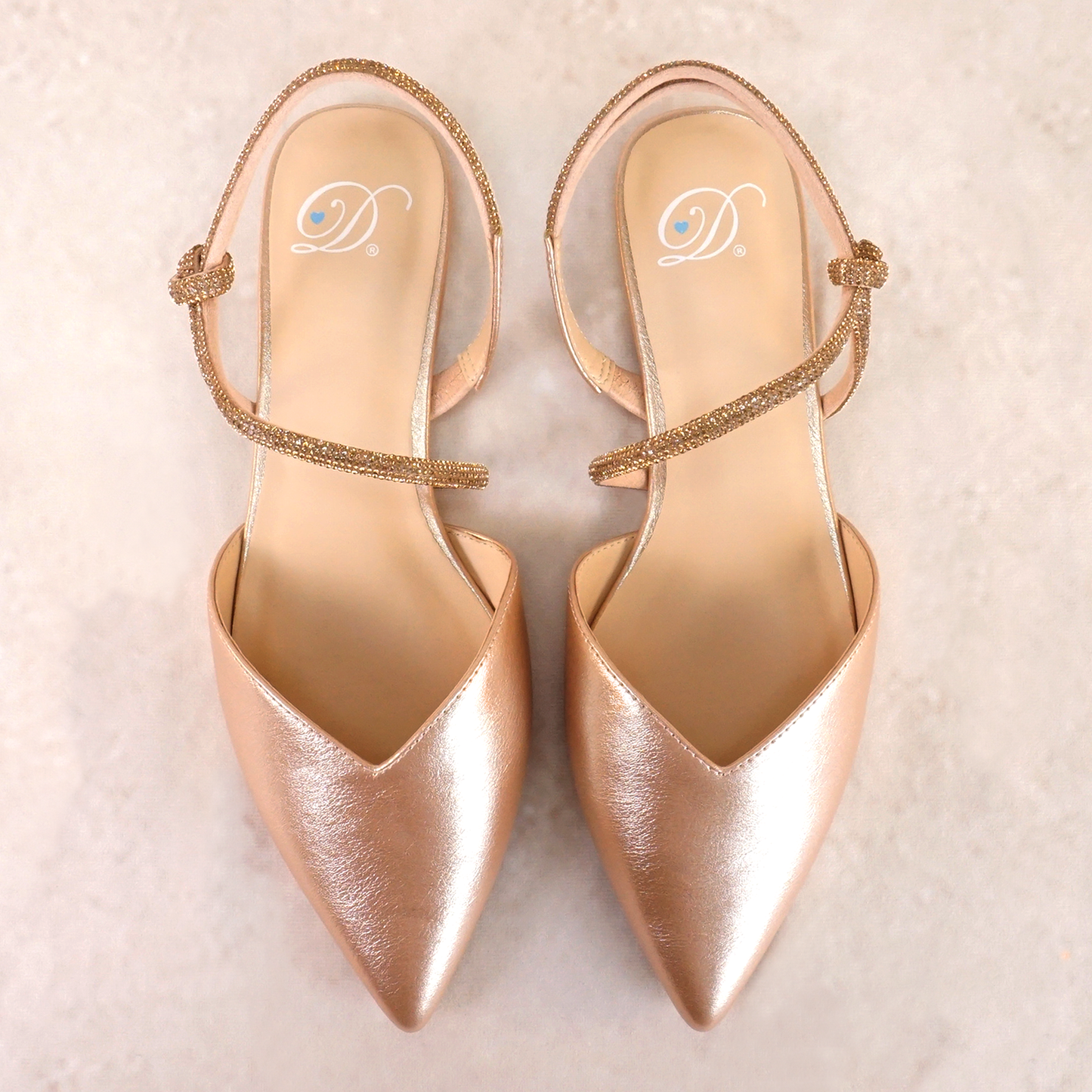 Pointed-toe slingback gold flat with rhinestone strap