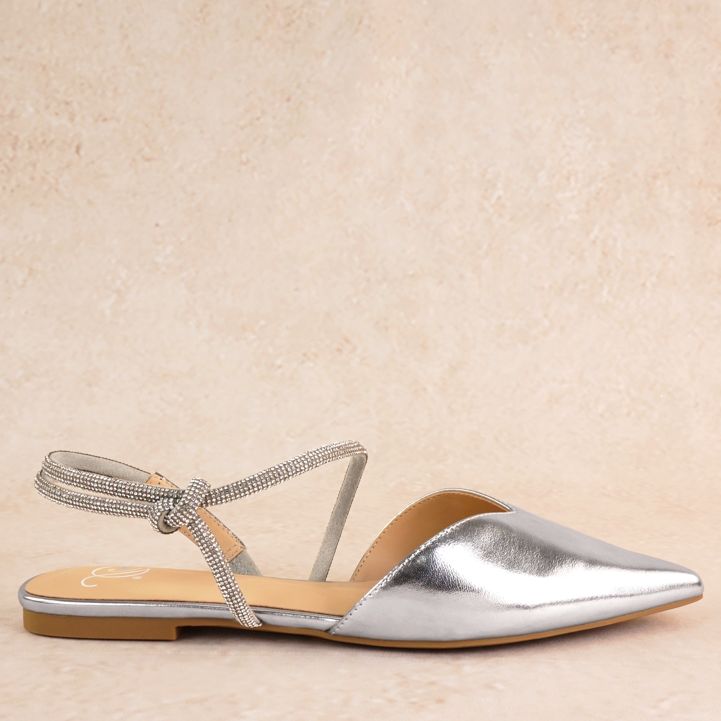 Pointed-toe slingback silver flat with rhinestone strap