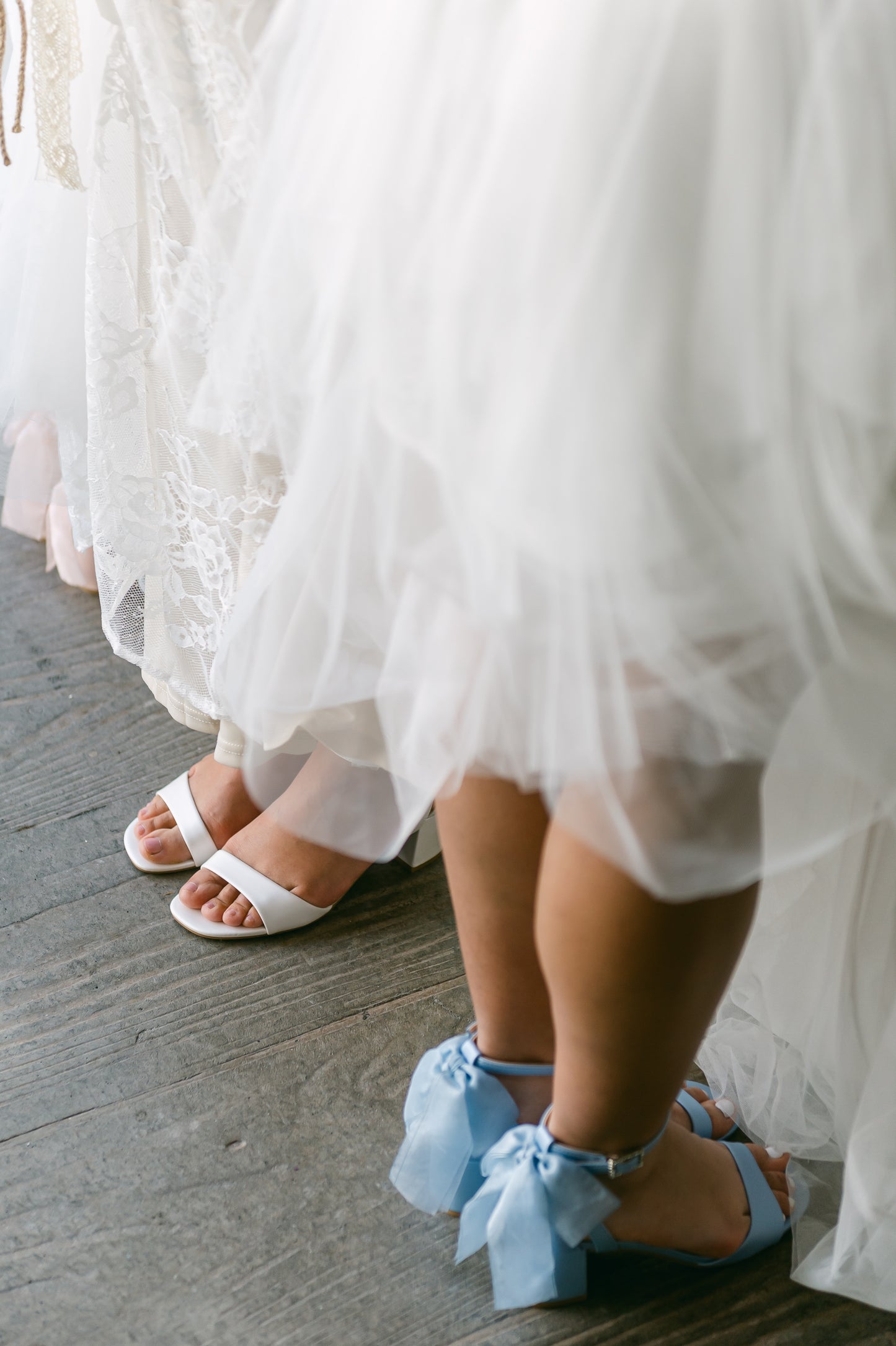 Simple low 2.5" block heels in white and blue with a bow at the back