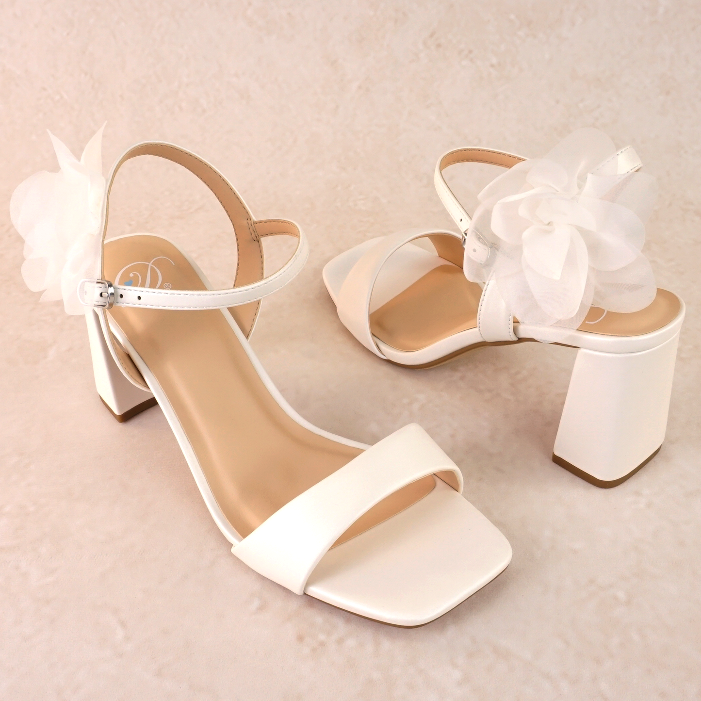 Flared 3" block heel in white with slim ankle strap and flower detail