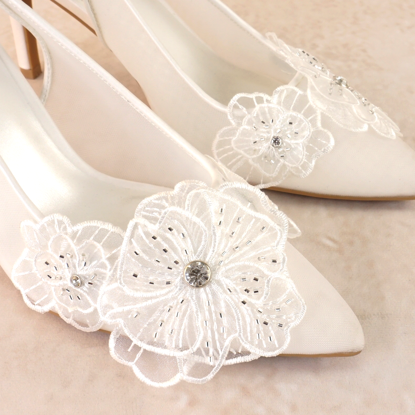 White mesh elasticized slingback pointed-toe 3.5" pump with rhinestone flower detail