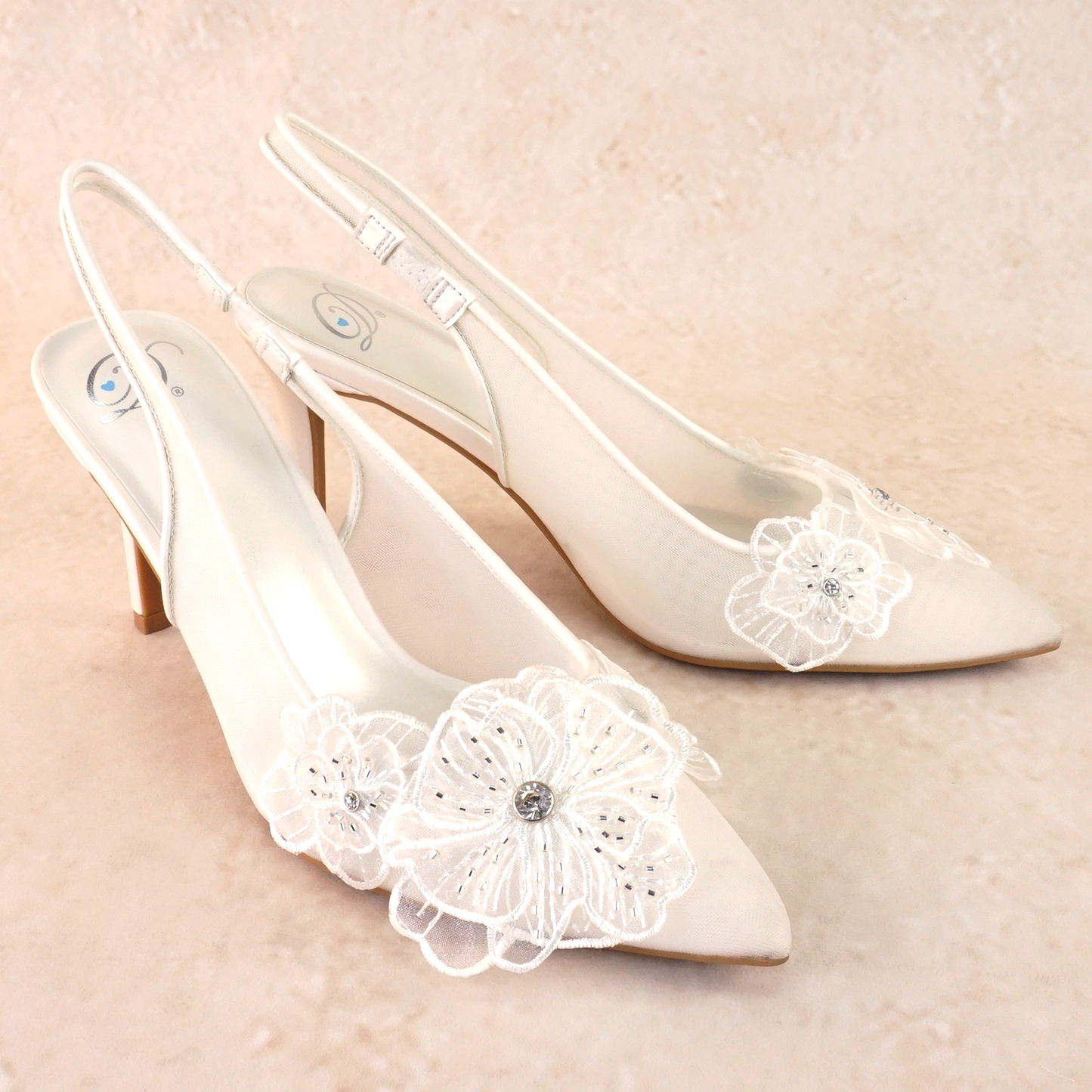 White mesh elasticized slingback pointed-toe 3.5" pump with rhinestone flower detail