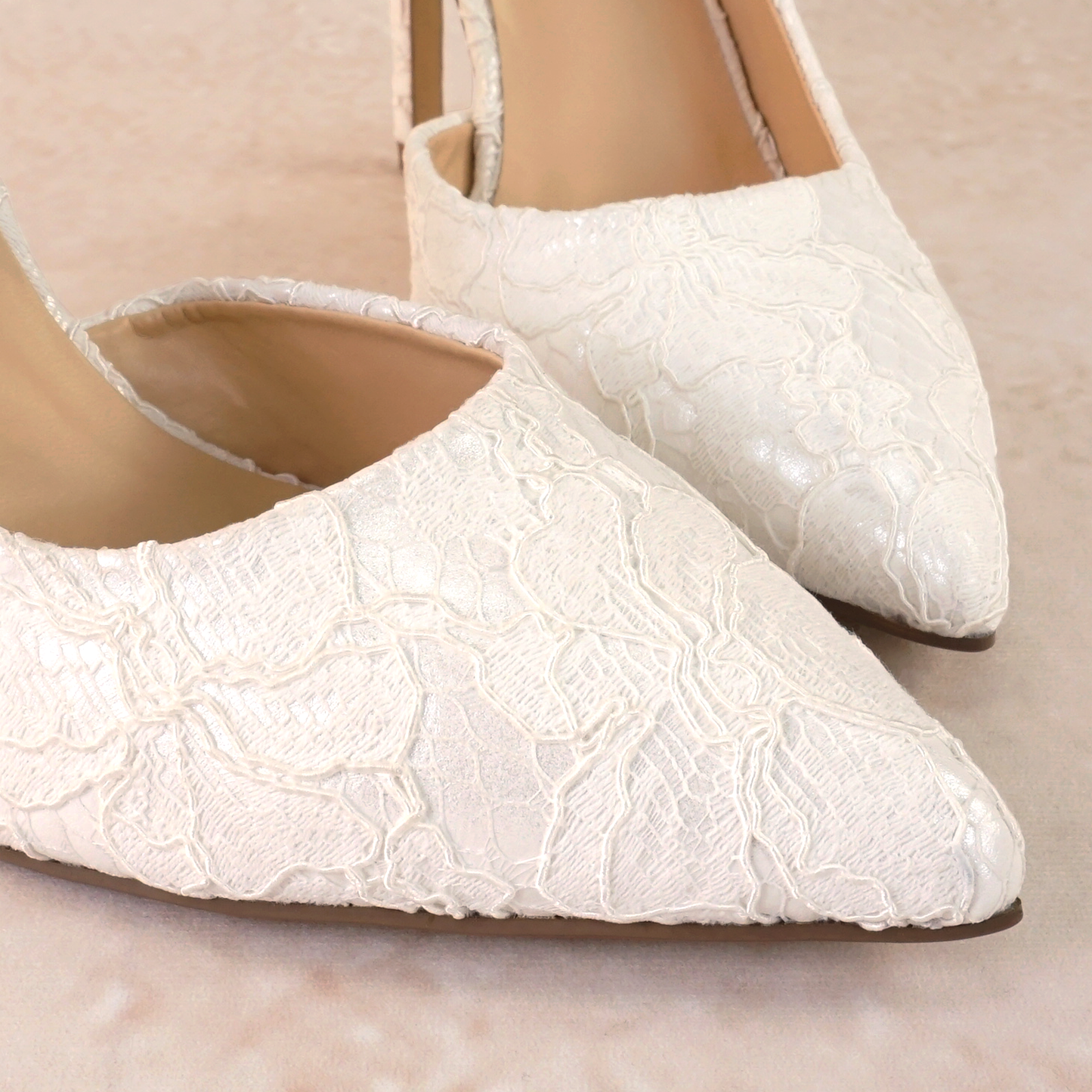 White lace d’orsay cut-out stiletto with a 4.25" heel