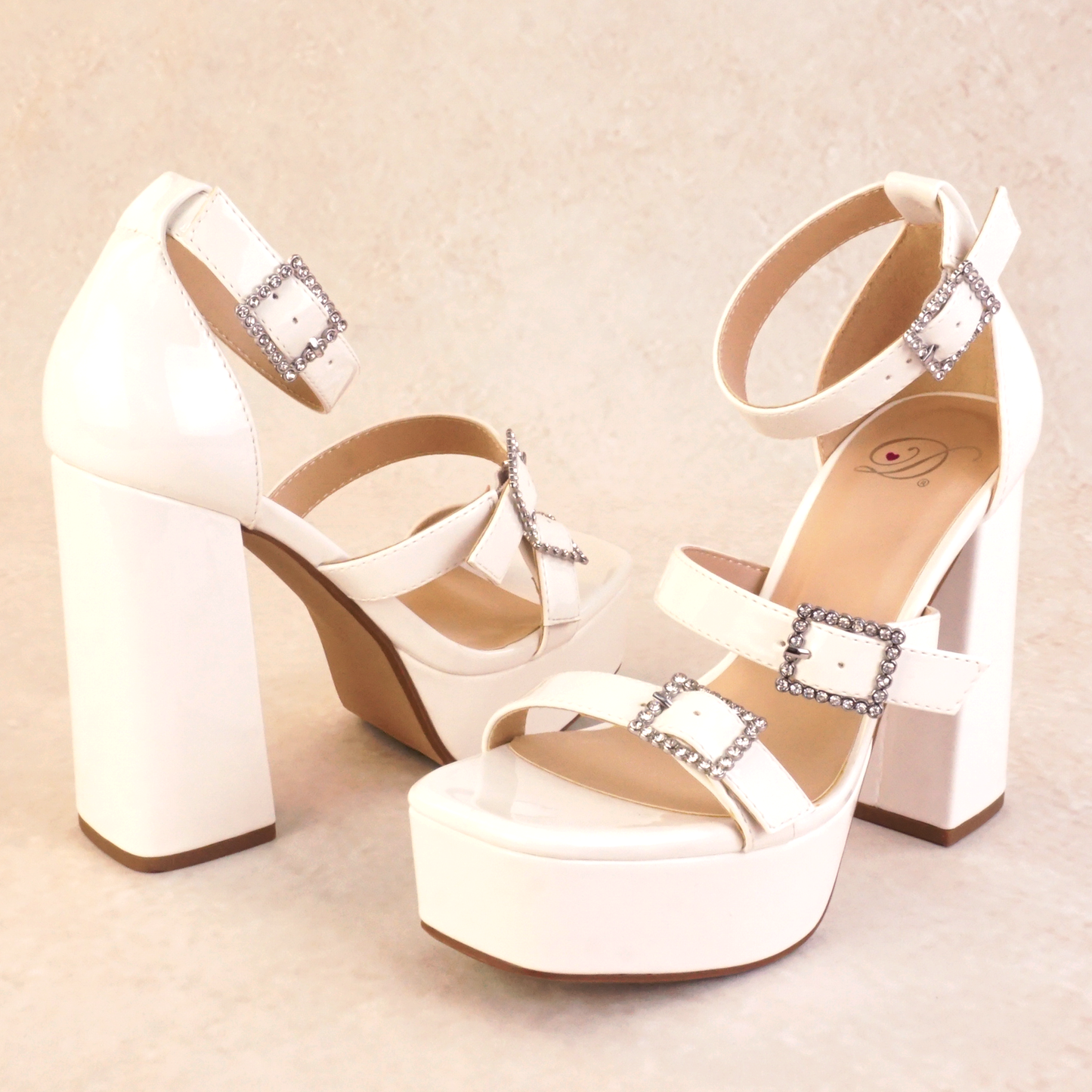 White patent block heels with rhinestone buckles