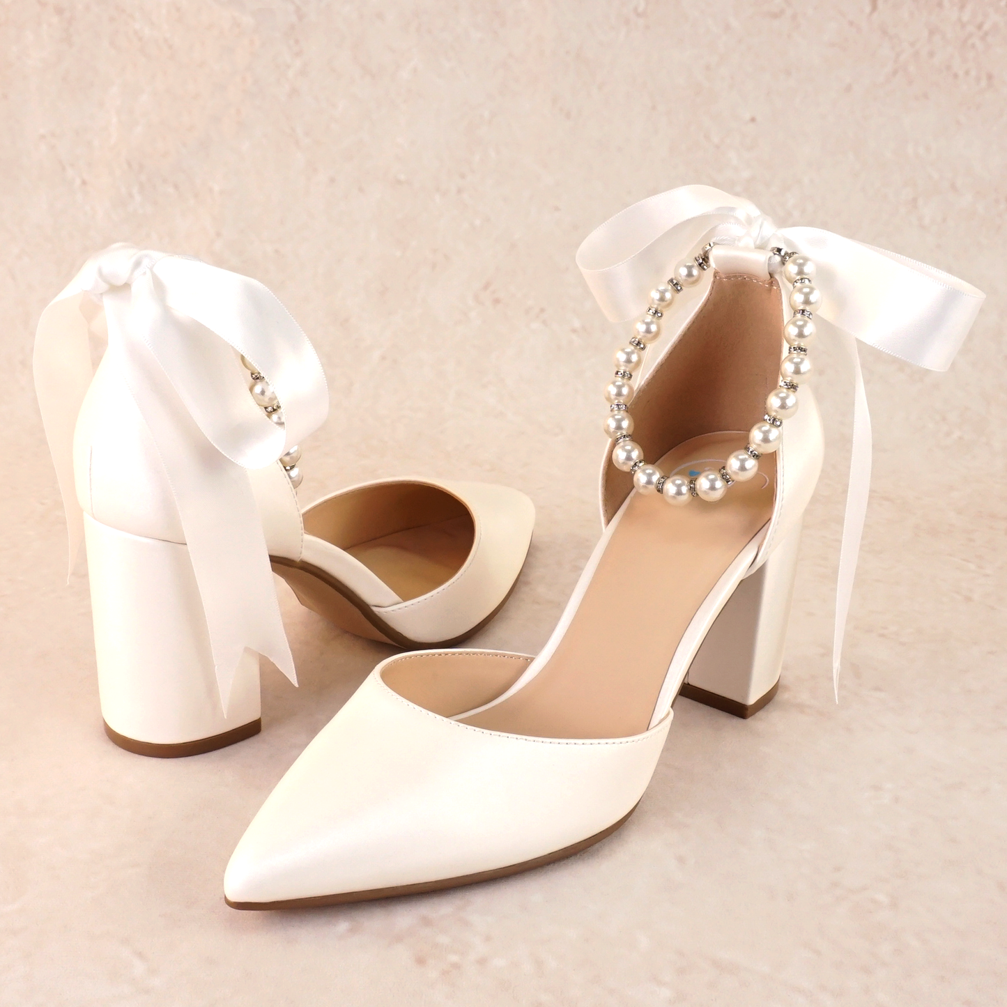 White d'orsay heel with adjustable pearl ribbon ankle tie and a 3.25" block heel
