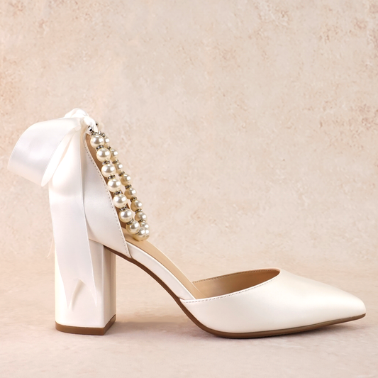 White d'orsay heel with adjustable pearl ribbon ankle tie and a 3.25" block heel