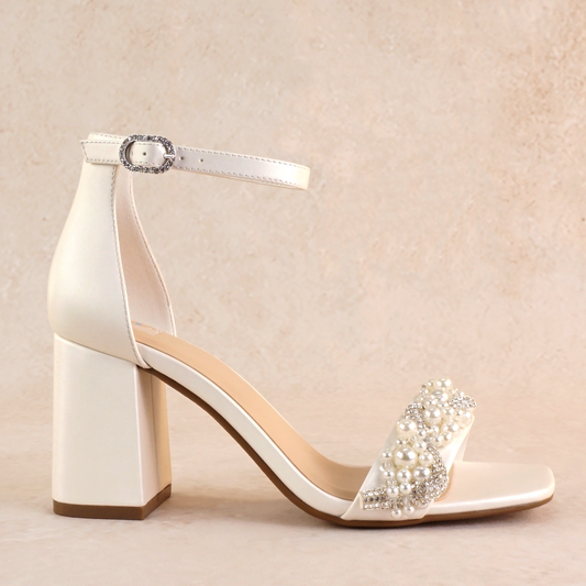 Pearls and rhinestones intertwined on a white single-band 3.25" ankle strap block heel