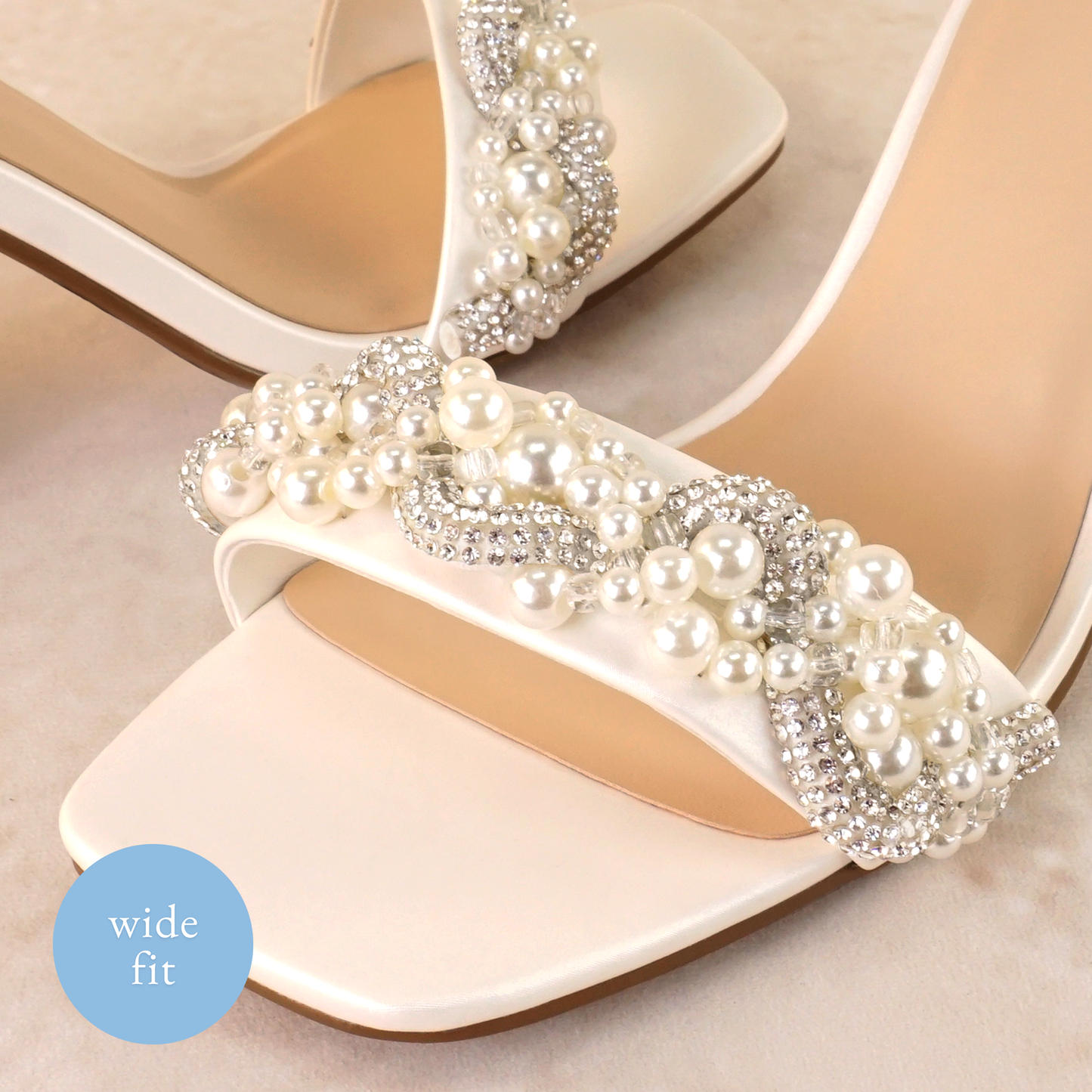 Pearls and rhinestones intertwined on a wide fit single-band 3.25" ankle strap block heel