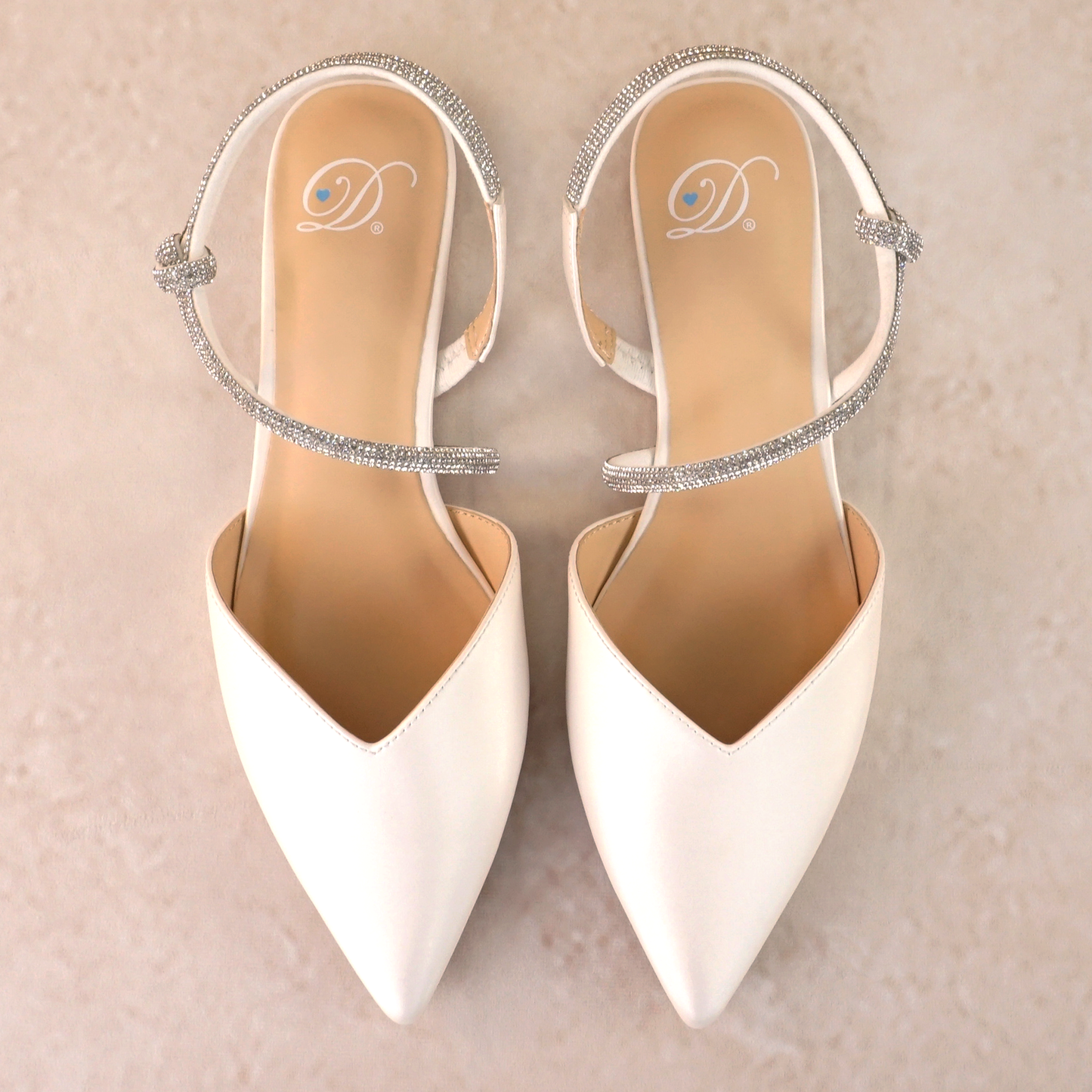 Pointed-toe slingback white flat with rhinestone strap