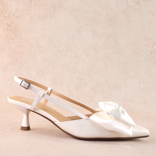 Classic white 2.25" kitten heel adjustable slingback with a satin bow
