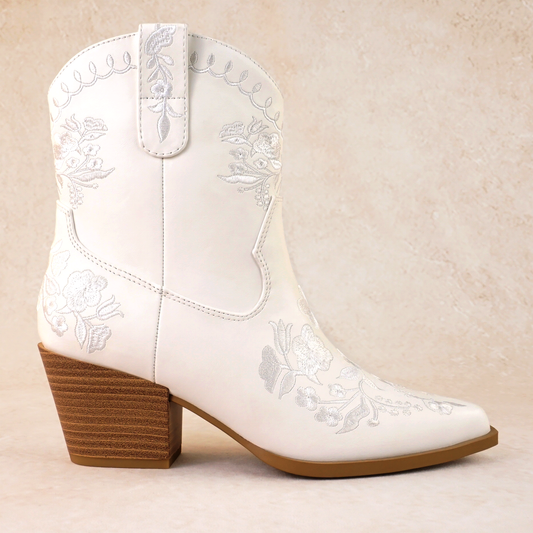 Western white bootie with embroidered flowers and a 2.75" stacked heel