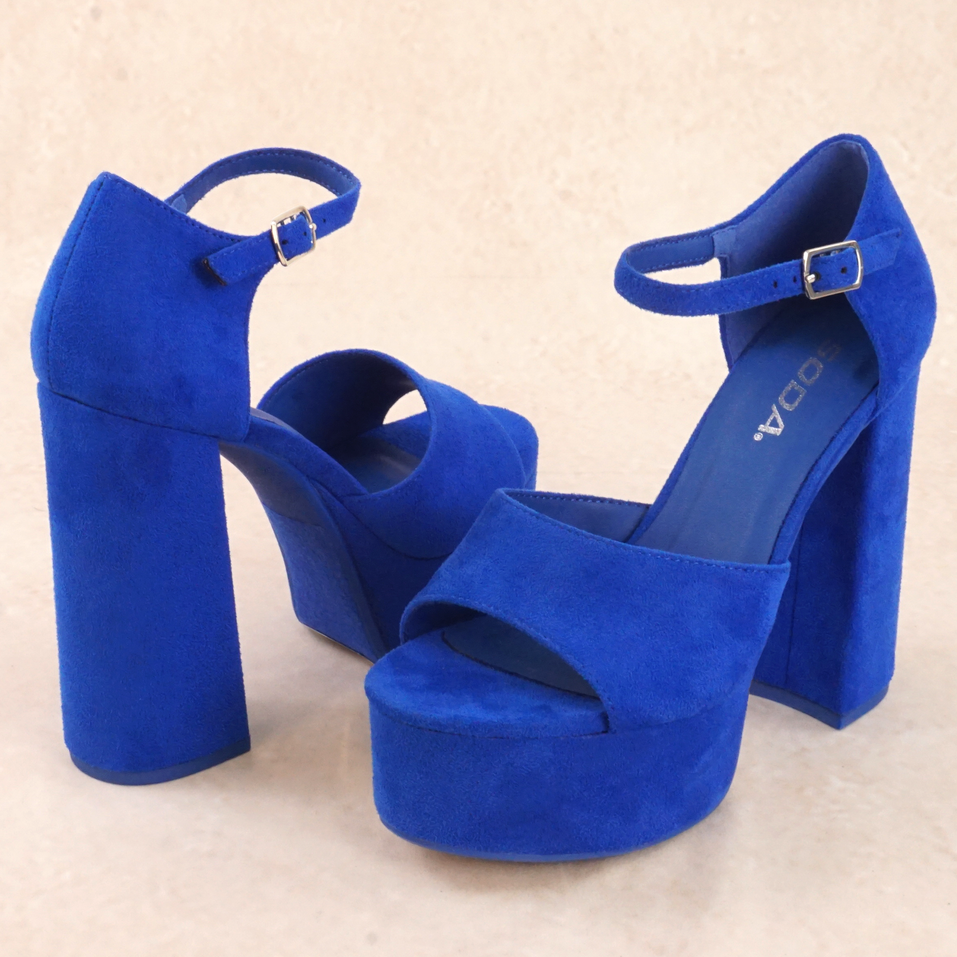 A pair of blue platform high heels with adjustable buckle ankle strap