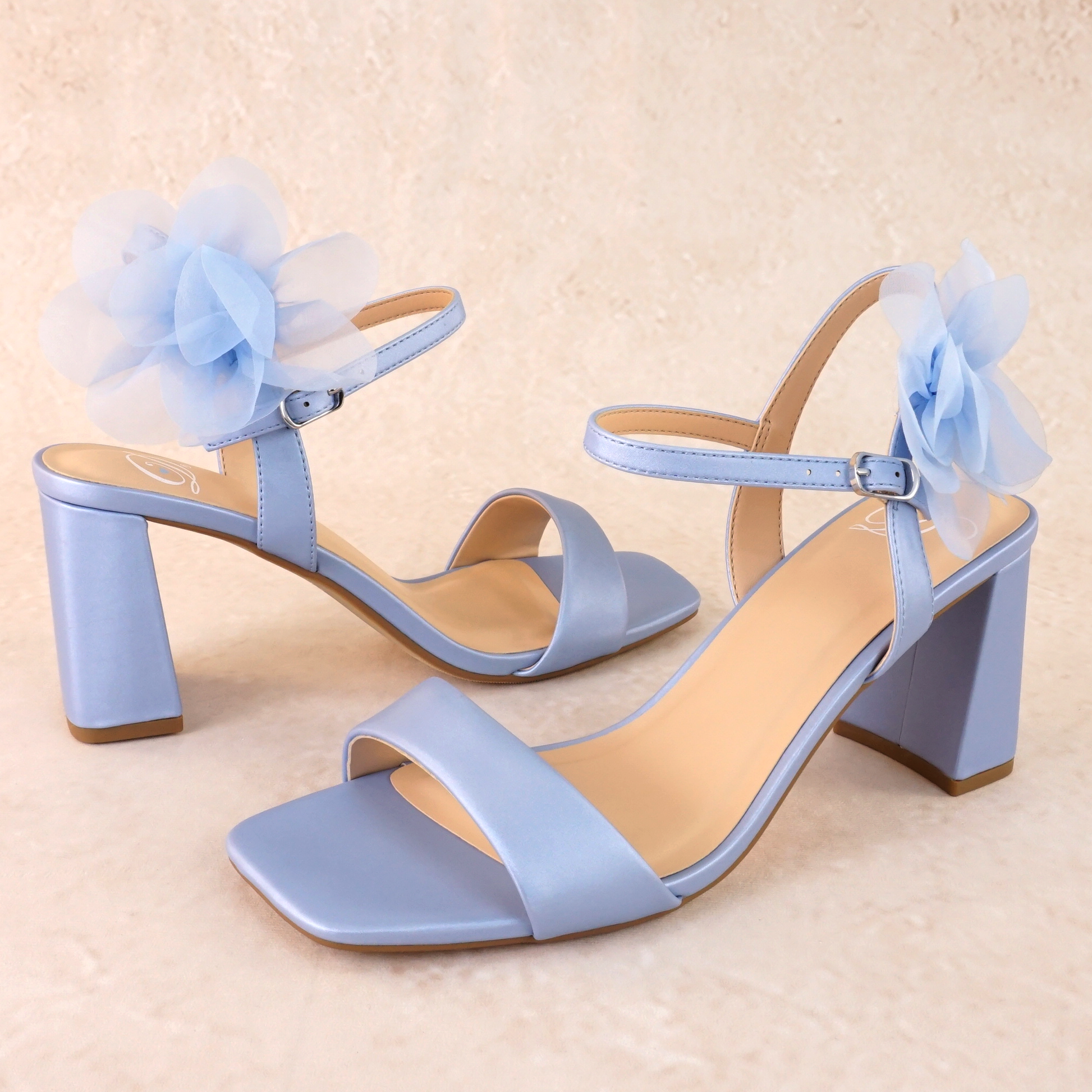 Flared 3" block heel in blue with slim ankle strap and flower detail 