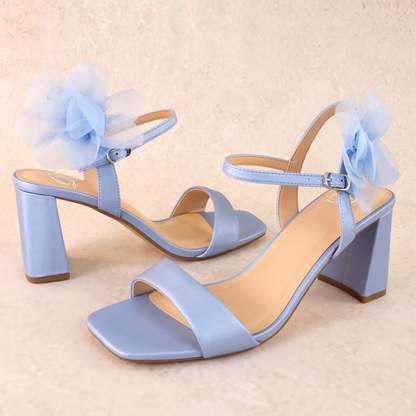 Flared 3" block heel in blue with slim ankle strap and flower detail 