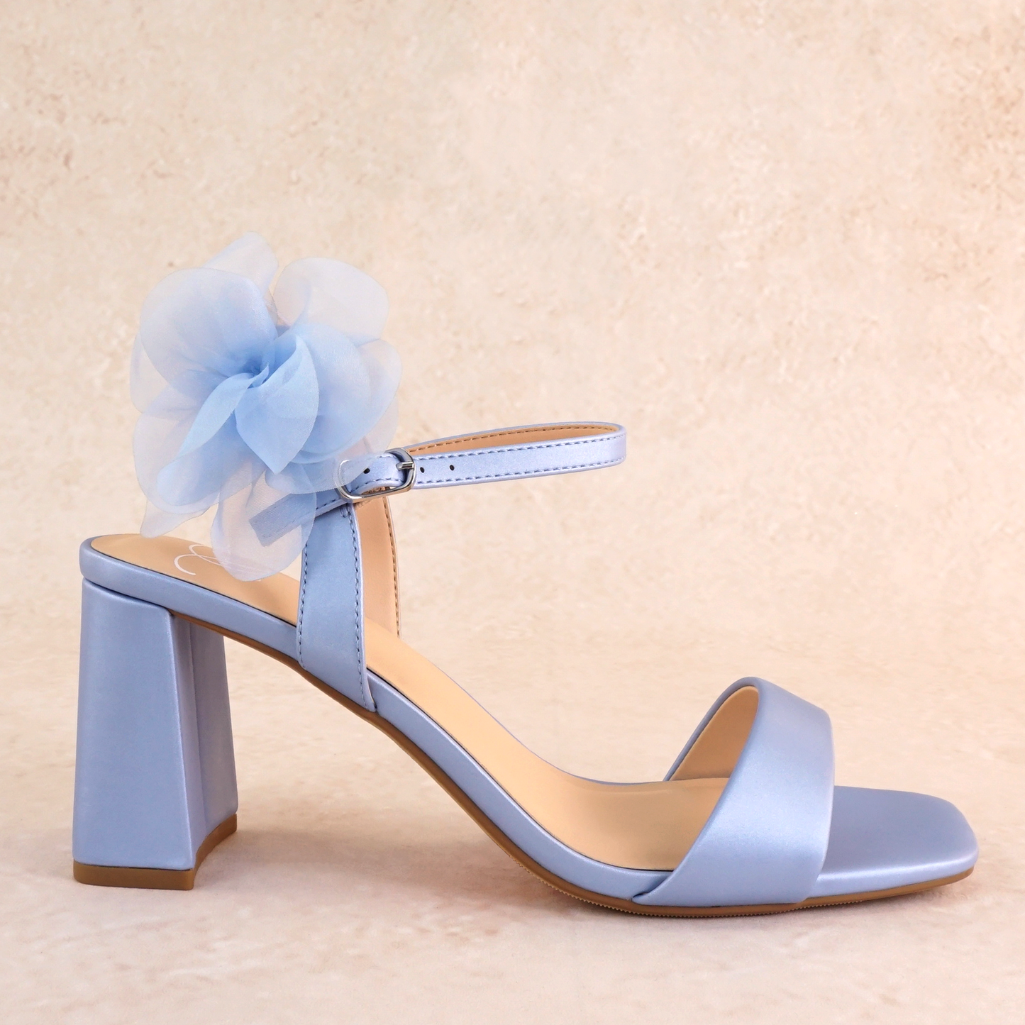 Flared 3" block heel in blue with slim ankle strap and flower detail 