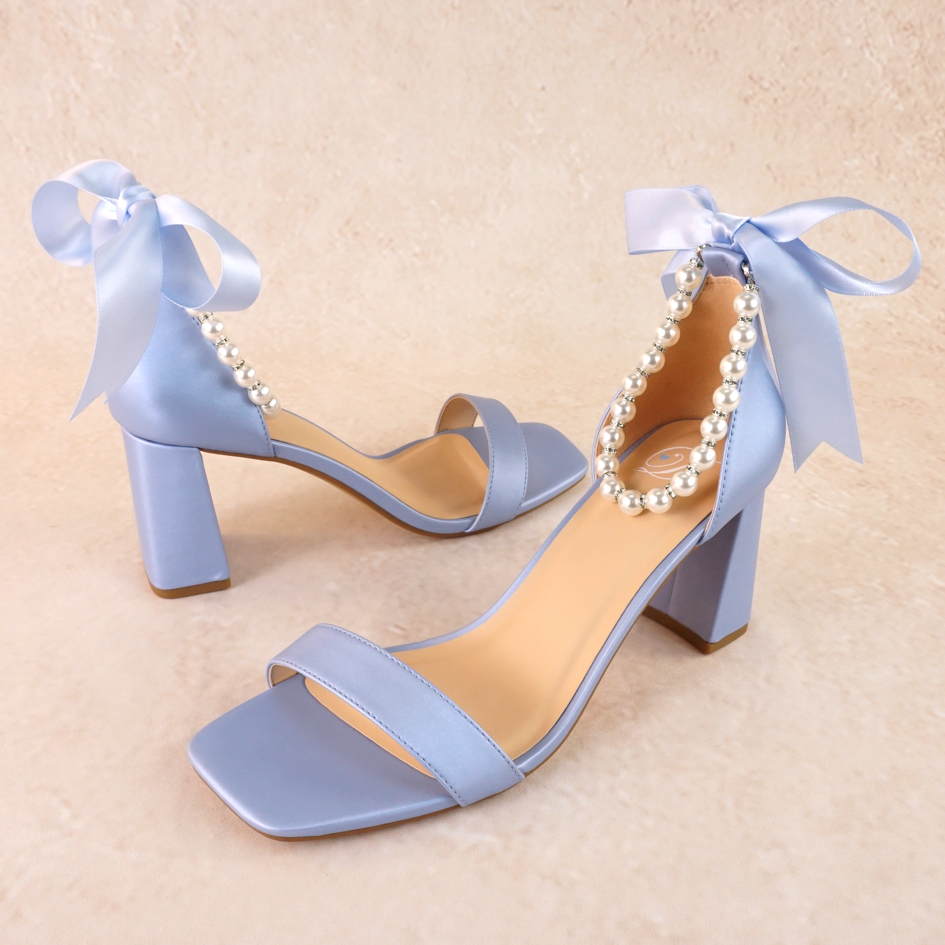 3" flared block heel in blue with adjustable pearl ankle strap and satin ribbon tie