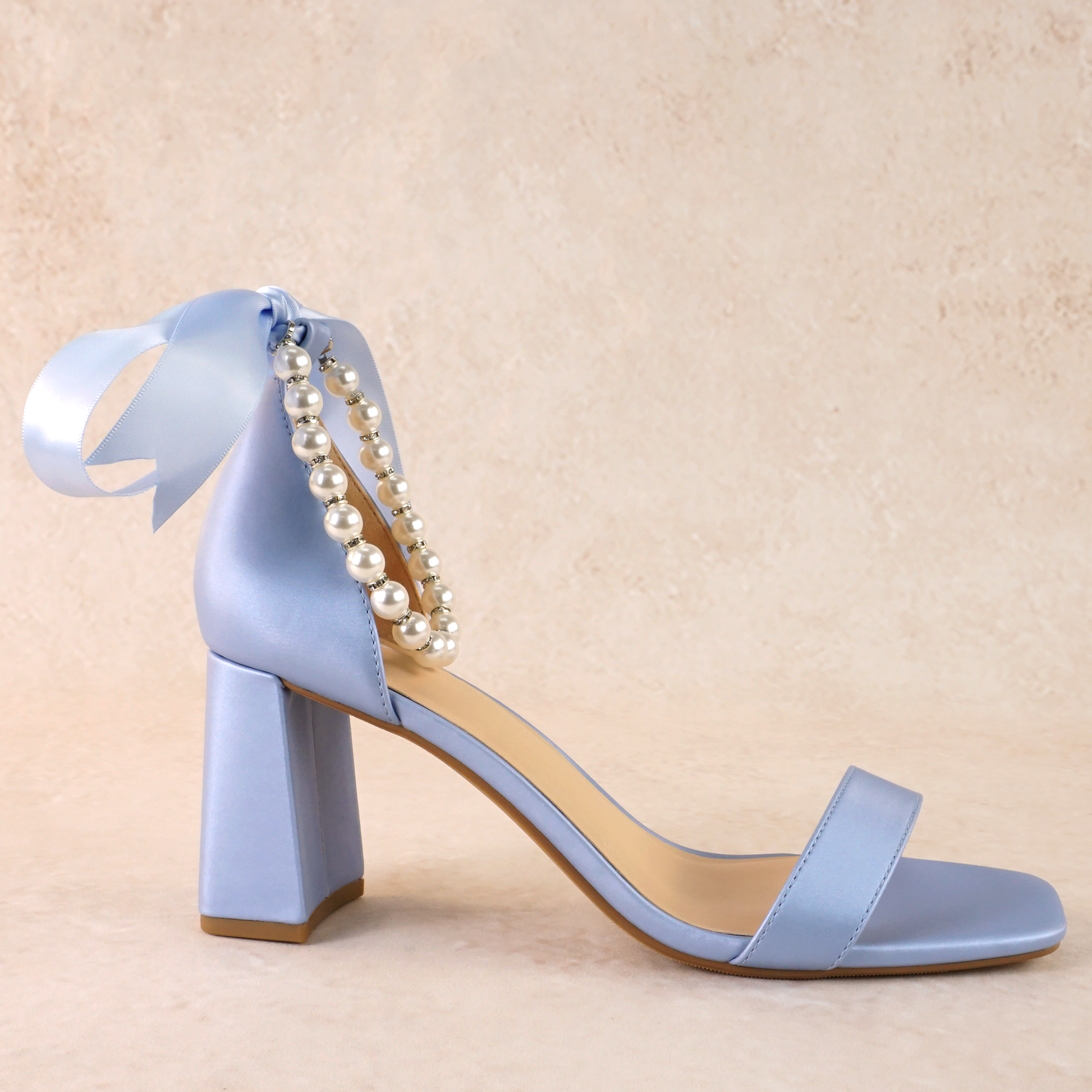3" flared block heel in blue with adjustable pearl ankle strap and satin ribbon tie