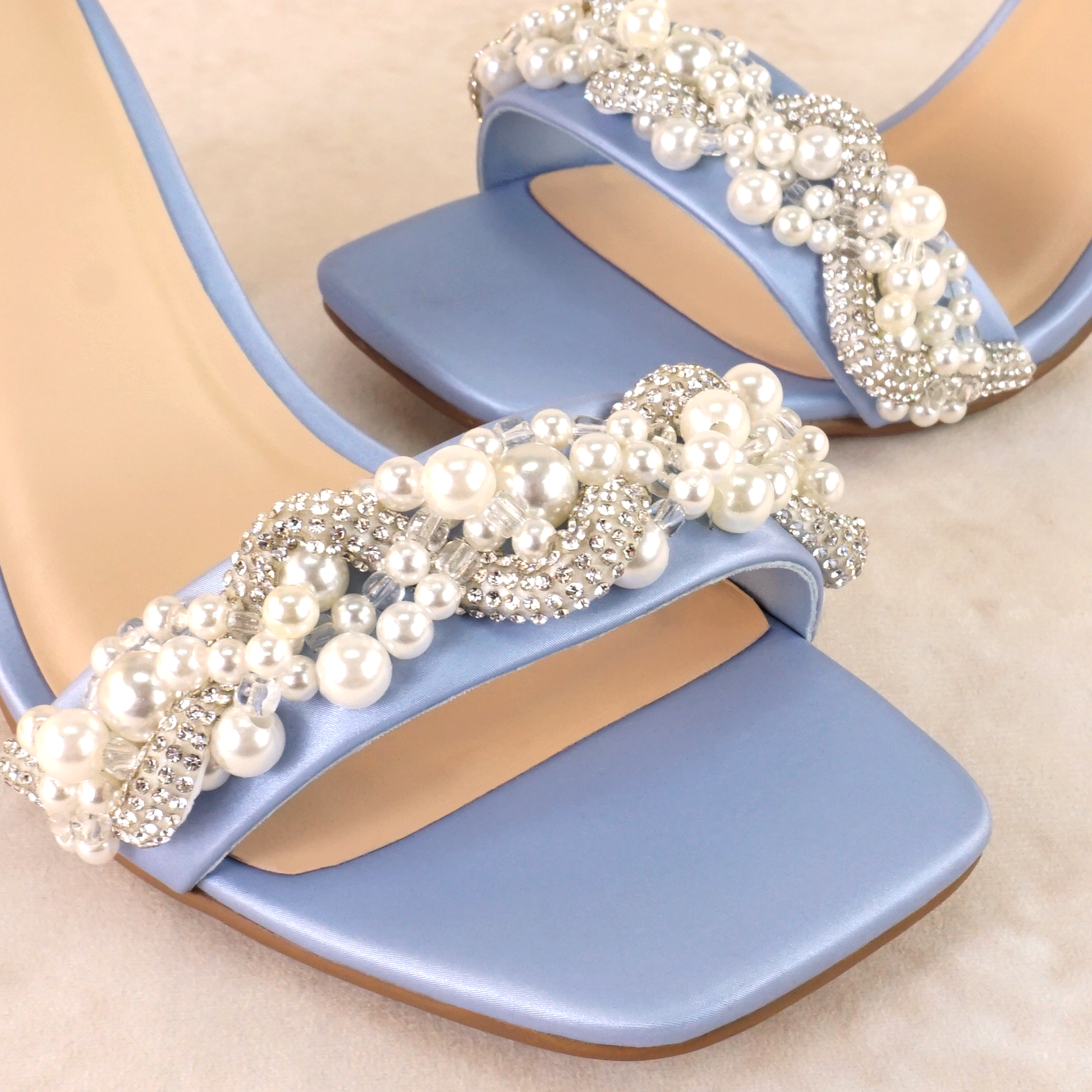 Pearls and rhinestones intertwined on a blue single-band 3.25" ankle strap block heel