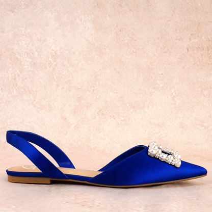 Slingback flat with a pearl buckle accent in a cobalt satin PU