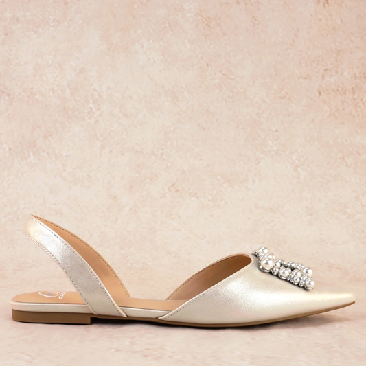 Slingback flat with a pearl buckle accent in a pearl shimmer