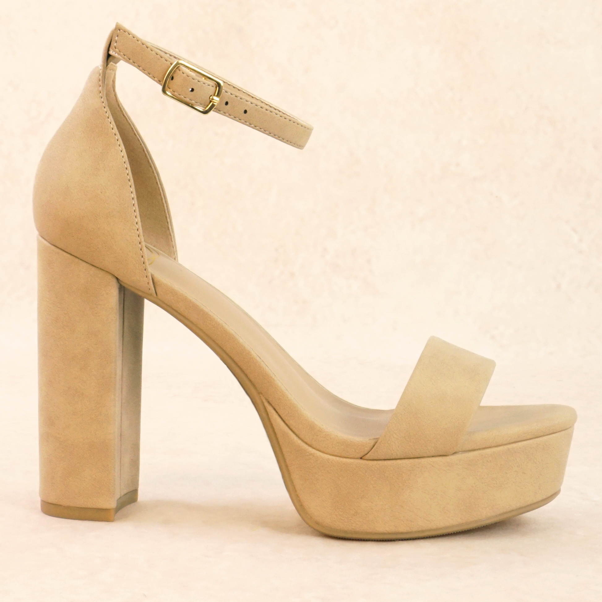 A dark nude open-toe high block heel with a platform in a soft nubuck material, with an adjustable ankle strap and single strap across the toes