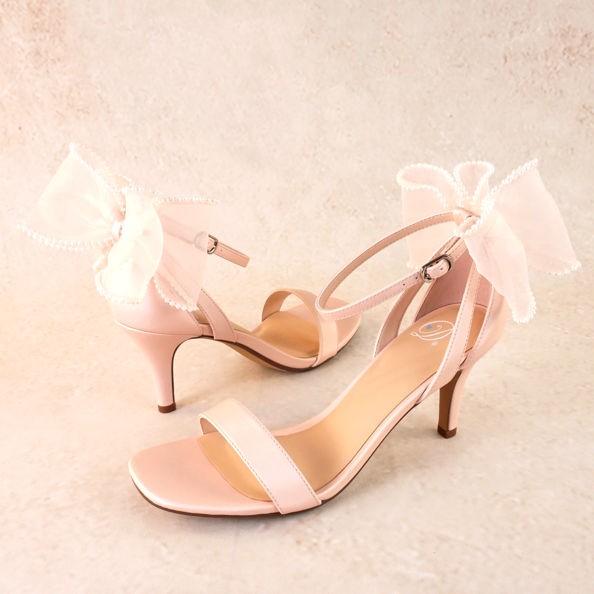 Simple single-band 3" stiletto heel in pink with a beaded bow on the back