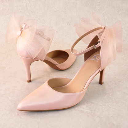 Pink d’orsay pump with ankle strap bow detail and a 3.25" stiletto heel