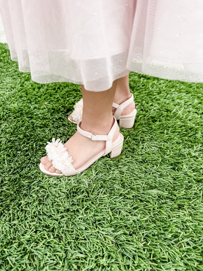 1.75" block heel single band pink sandal with floral detail being worn