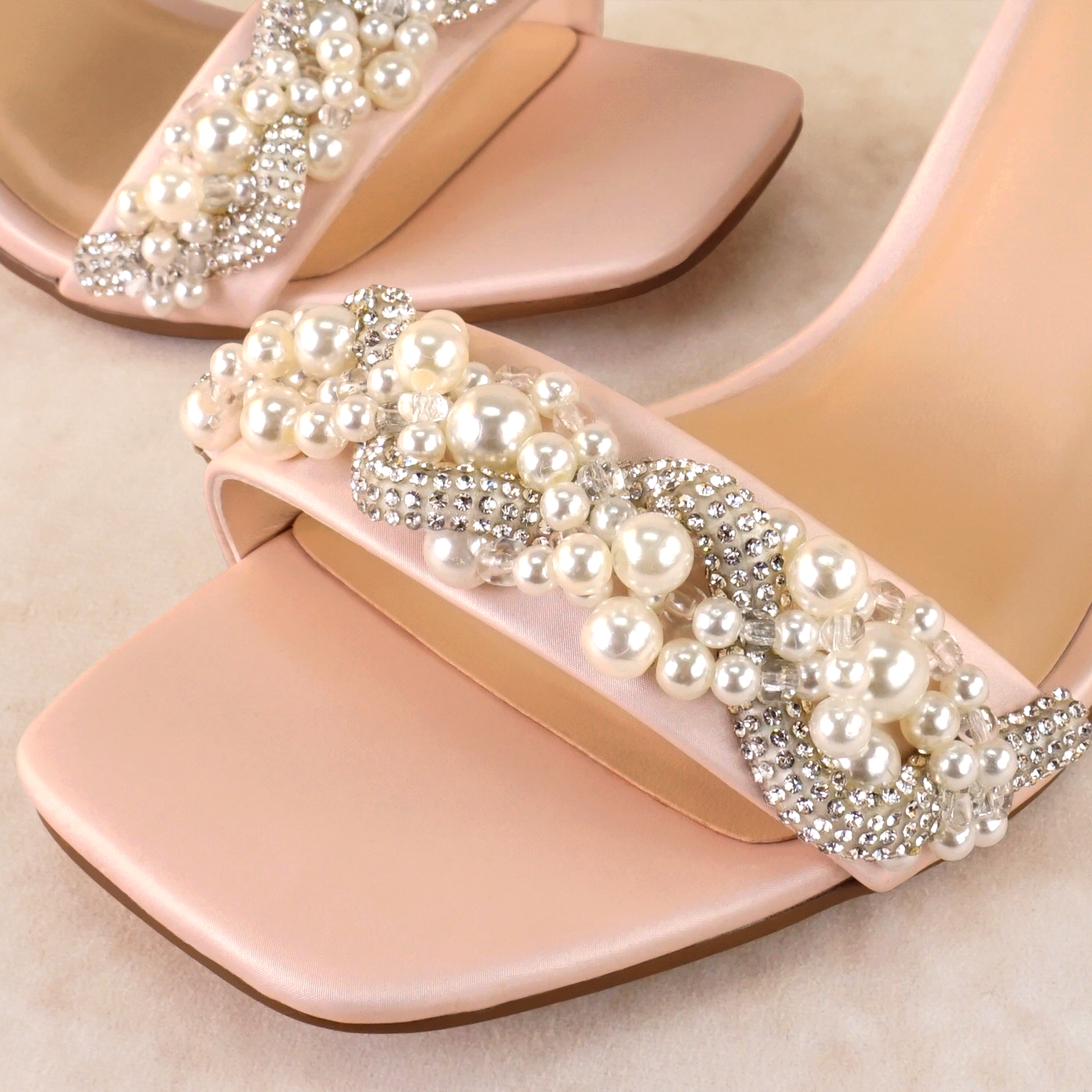 Pearls and rhinestones intertwined on a pink single-band 3.25" ankle strap block heel