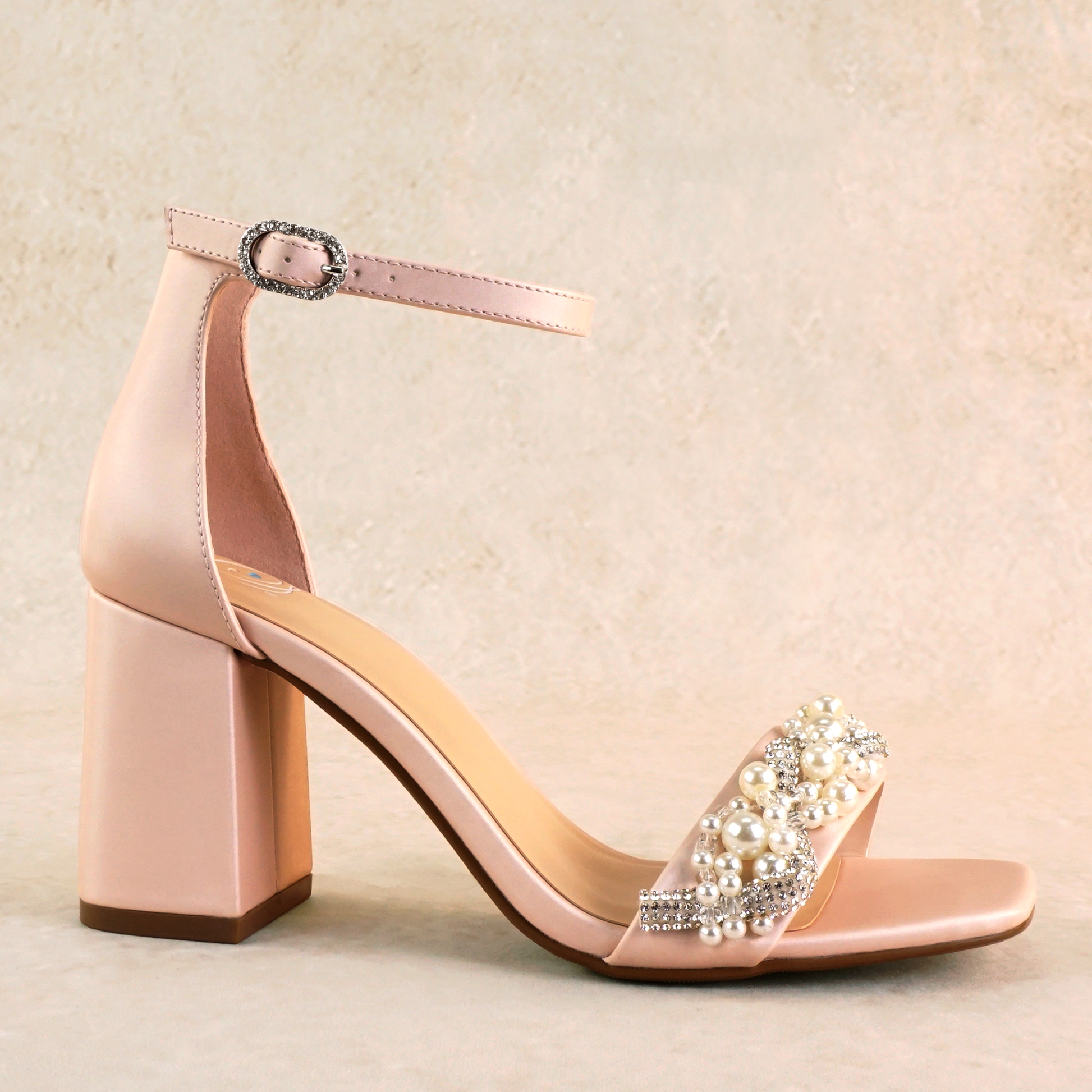 Pearls and rhinestones intertwined on a pink single-band 3.25" ankle strap block heel