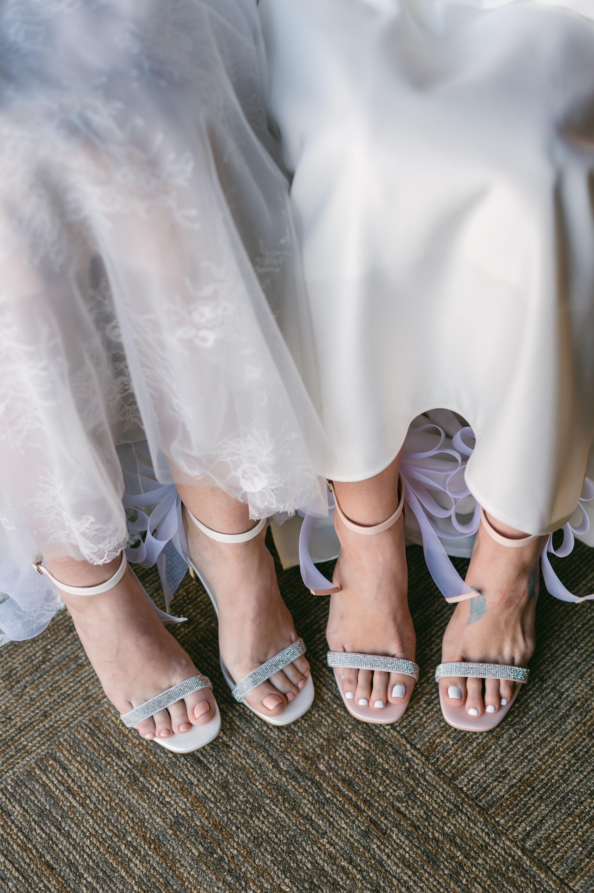 4" stiletto heels in pink and white with rhinestone band and wire mesh statement bow worn by two women in white dresses
