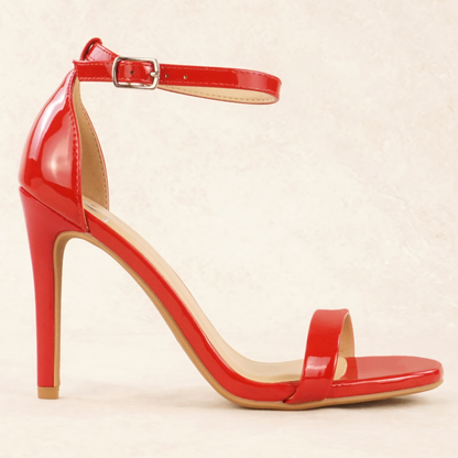 A red patent material stiletto heel with adjustable ankle strap