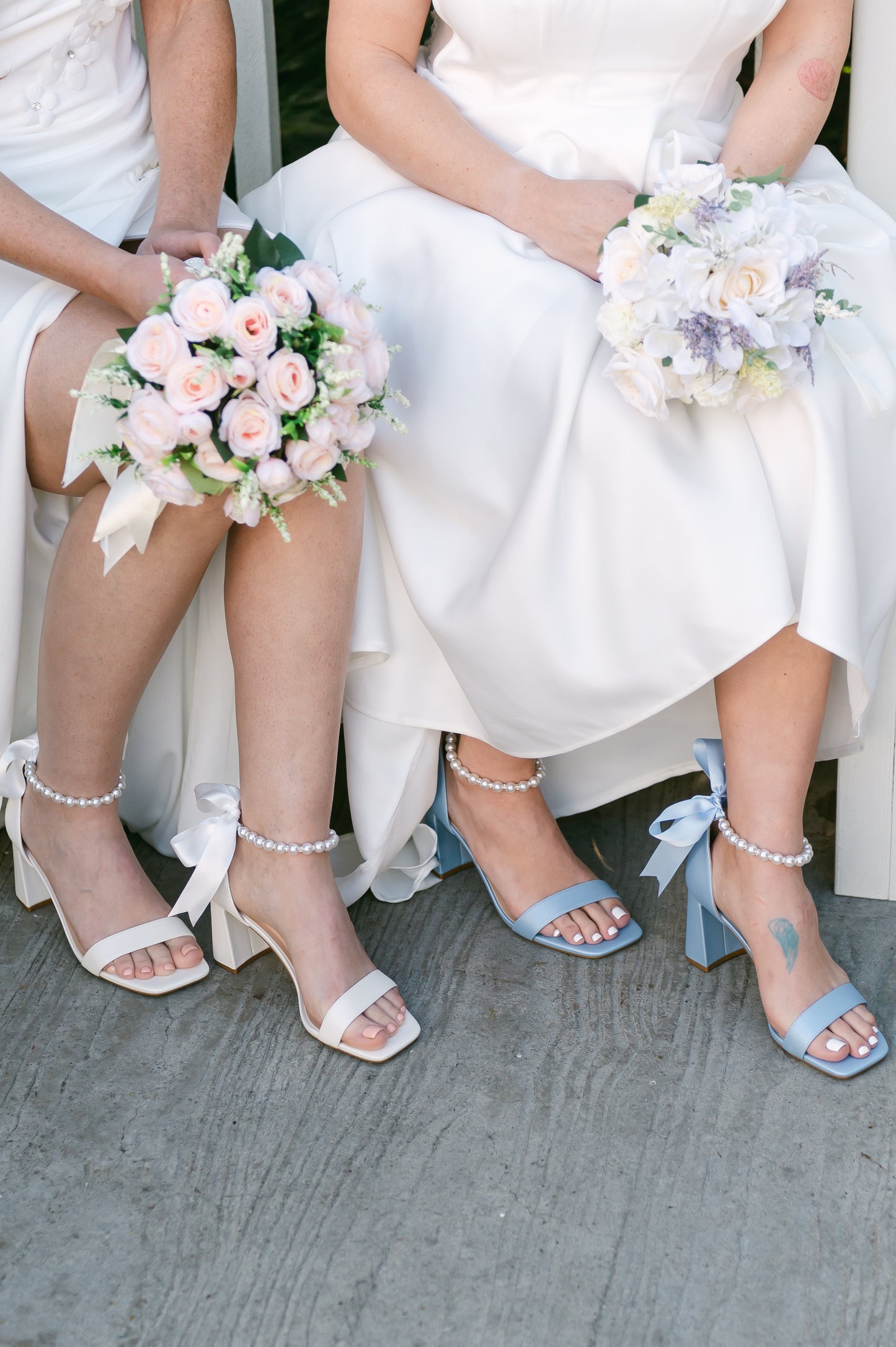 3" flared block heels in blue and white with adjustable pearl ankle strap and satin ribbon tie worn by two women in white dresses