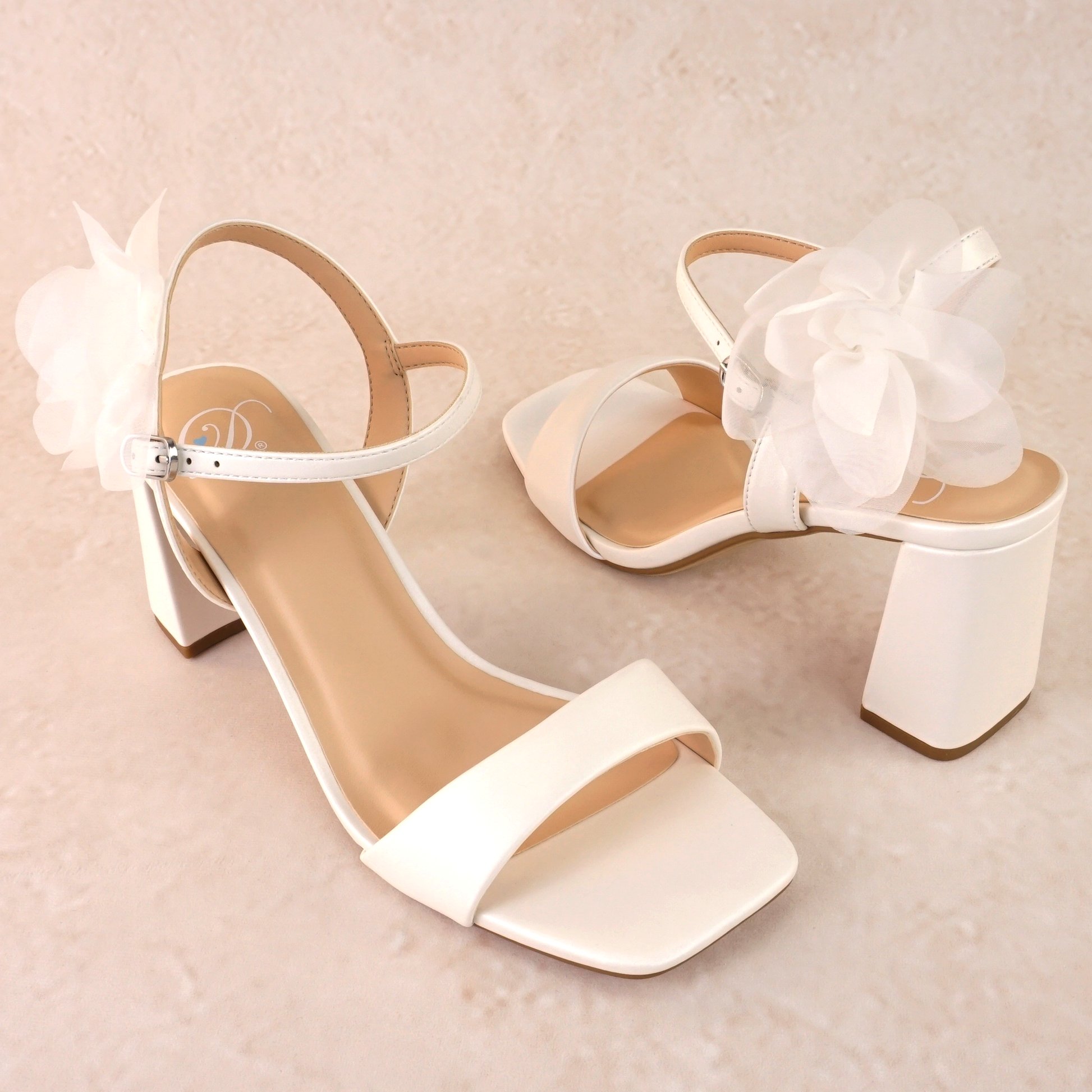 Flared 3" block heel in white with slim ankle strap and flower detail 