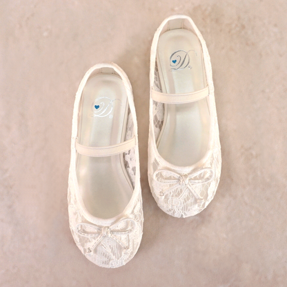 Allover lace flat with elasticized Mary Jane strap and bow detail