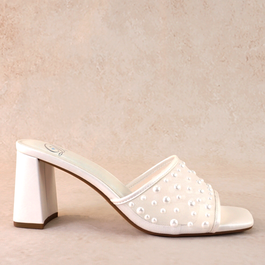 Mesh heeled white slide sandal with a 3" heel and pearls studded all over