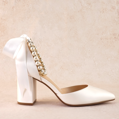 White d'orsay heel with adjustable pearl ribbon ankle tie and a 3.25" block heel