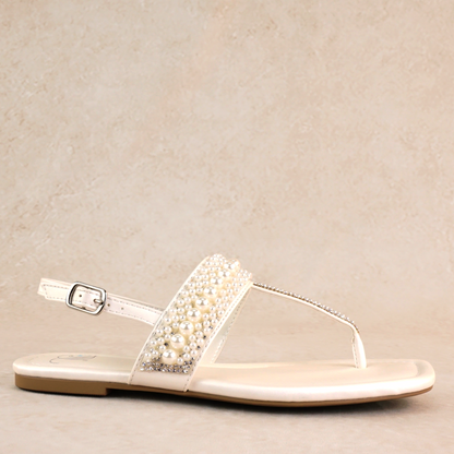 T-strap white sandal with adjustable slingback and pearl and rhinestone accents