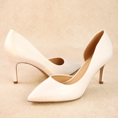 A pair of white satin d'orsay pump heels 